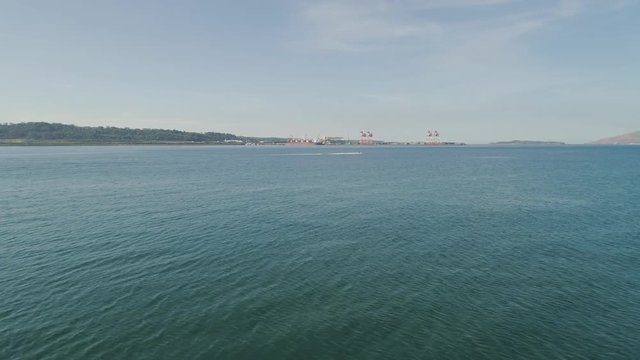 Sea cargo port with cranes, docks, containers in Subic Bay. Philippines,Luzon. Aerial view: cargo port and container terminal.
