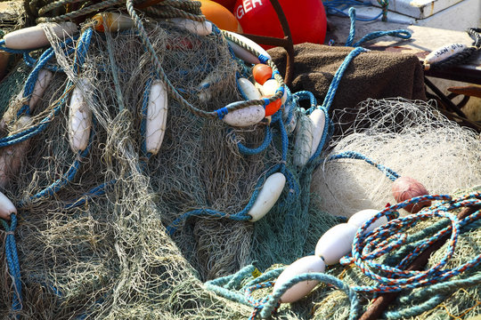 Sea fishing nets drying on a boat at filey bay england UK