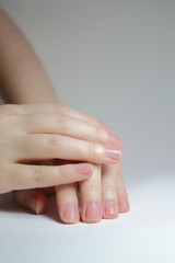 Female hands and nails are done. Long nails might be unsafe and carry on bacterias. Short nails are healthier 
