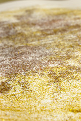 Orange, Yellow,Gold and Bronze shiny textured Glitter paint on a White background