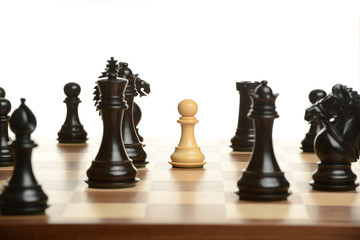 Pawn chess pawn surrounded by black opponents