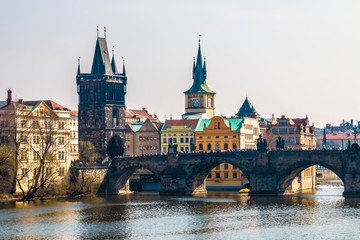 Fototapeta na wymiar Charles Bridge with tourists and Vltava river in Prague. Famous landmark of Czech Republic
