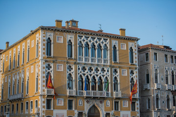 Tradional windows and balconies of an old building in Venice, Italy