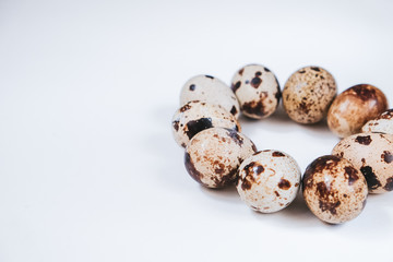 Fresh quail eggs on white background