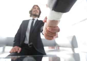 Close-up of two business people shaking hands