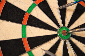 darts close-up with a dart at the center