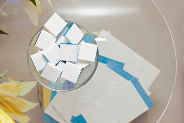 square chocolates for advertising on table with flyers