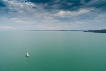Fototapeta na wymiar White sailing boat in Lake Balaton