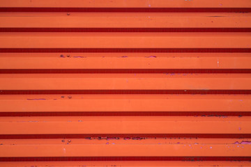 red metal plate background texture with ridges 