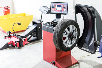 Car maintenance and service center. Vehicle tire  repair and replacement equipment.  Seasonal tire...