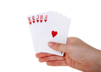 Young female hand holding Playing cards, royal flush. It is a straight flush that has a high card value of Ace. This is the highest hand in the game of poker. Hearts. Generic cards NO FACES SHOWING