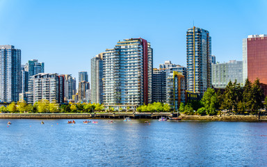 Fototapeta na wymiar Skyline of the City of Vancouver, British Columbia, Canada as seen from the False Creek Inlet on a clear summer day
