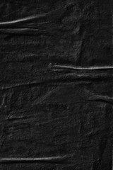 Dark black grey creased crumpled paper background surface old torn ripped posters scary grunge texture backdrop   