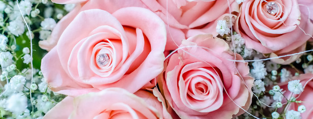Bouquet of pink roses with small briliants
