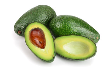 whole and half avocado isolated on white background close-up. Top view