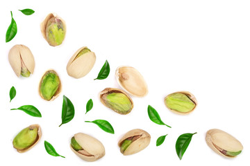 Pistachios with leaves isolated on white background with copy space for your text, top view. Flat lay pattern