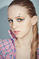 portrait of beauty girl with colorful make-up and long hair