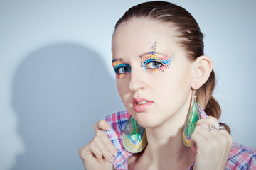 portrait of beauty girl with colorful make-up and long hair