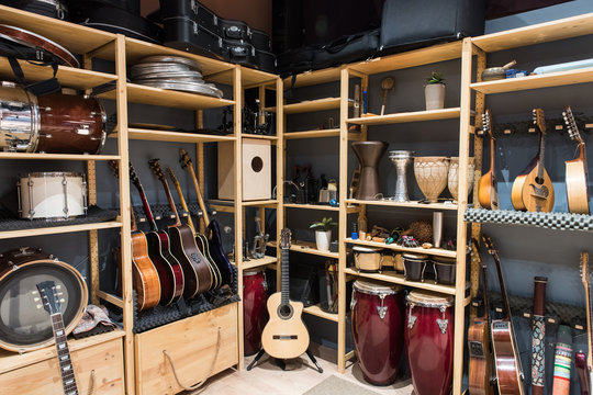 Shelf with drums and guitars