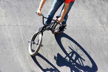 boy riding a bike on a special hill
