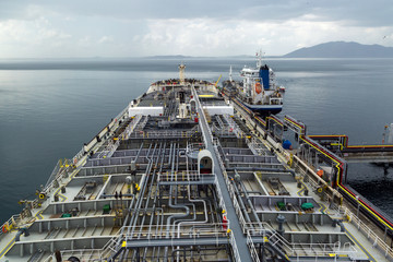 Crude oil tanker discharging to the terminal.