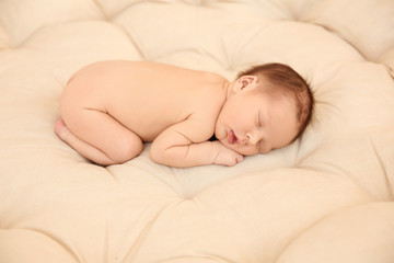 Obraz na płótnie Canvas Adorable newborn baby sleeping on bed
