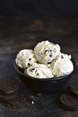 Homemade vanilla ice cream with chocolate and cookies.