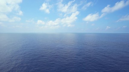 Aerial shot of open ocean. Flight over of open sea.