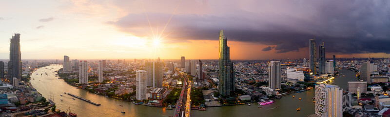 Aerial view of Bangkok modern office buildings, condominium, living place in Bangkok city downtown with sunset scenery, Bangkok is the most populated city in Southeast Asia.Bangkok , Thailand