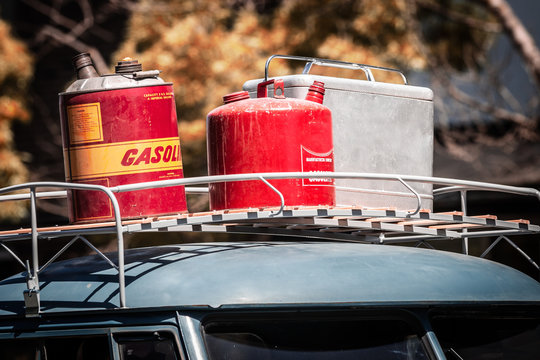 Gas Cans And Ice Chest On Top In Car Top Carrier