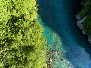 Naklejka na ściany i meble Top drone view at blue mountain river