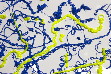 Neon Blue and Yellow paint splatter on a White background