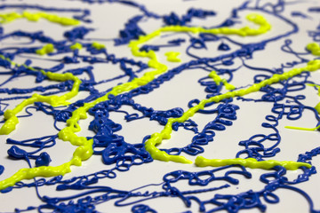 Neon Blue and Yellow paint splatter on a White background