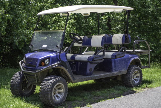 Blue-white dirty club Car Golf Cart.