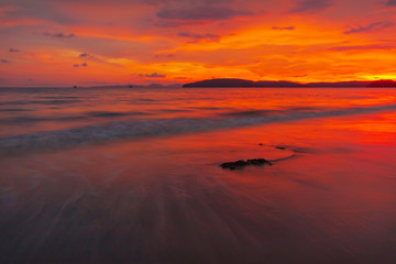 Fototapeta na wymiar Sunset on the beach at Ao Nang , Krabi , Thailand