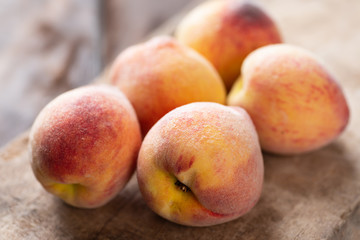 Ripe peaches on wooden, tropical fruit
