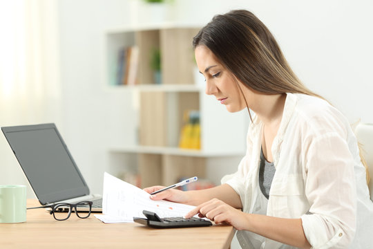 Woman doing domestic accounting at home