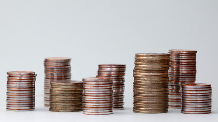 Piles of different heights of coins.