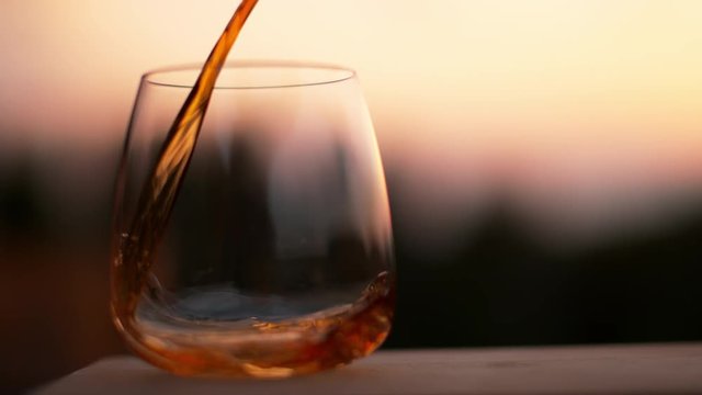 Pouring rum in super slowmotion at sunset, shot with high speed camera Phantom VEO 4K , 1000fps.