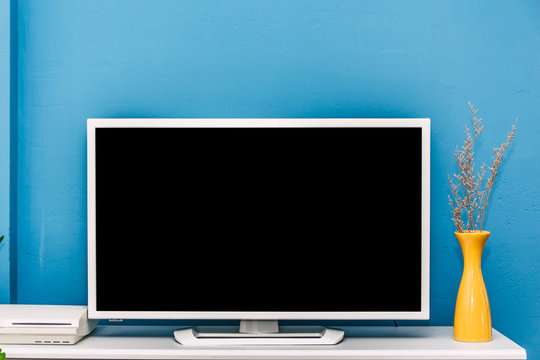 Smart Tv Mockup On Blue Wall Background In Modern Living Room