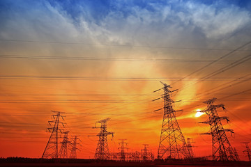 Fototapeta premium Electric tower, silhouette at sunset