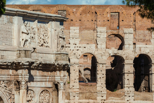 Antiquities, archeology and vistiges of the past in Rome. Coliseum monumental arches and Arch of Constantinus side by side