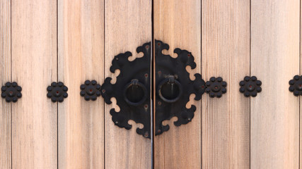 A close-up of the old Korean house door.