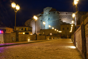 Fototapeta na wymiar Evening image of Castel Dell Ovo in the Bay of Naples during the blue hour.