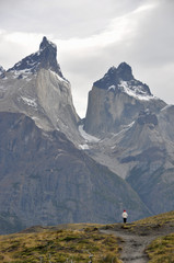 tourist impressed by view of Cuernos del Paine at Torres del Paine national park, Patagonia, Chile