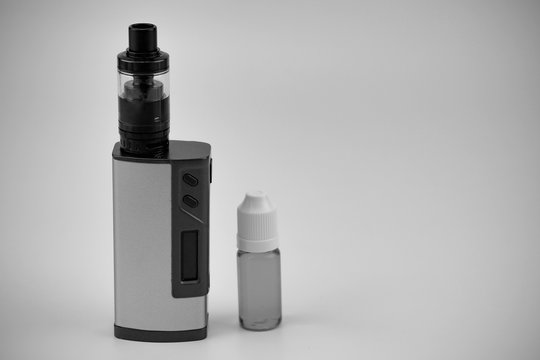 E - cigarette for vaping , technical devices.The liquid in the bottle   