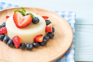 yogurt pudding with fresh strawberries and blueberries