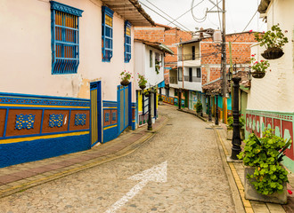Fototapeta na wymiar A view of a colourful street view in Guatape, Colombia.