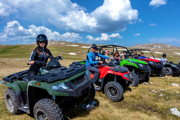 Friends driving off-road with quad bike or ATV and UTV vehicles © FS-Stock