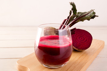 Beetroot cold pressed juice in glass, Healthy raw vegetable and fruit drink for detox. 